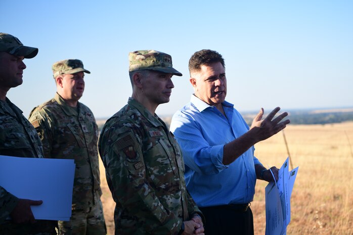 U.S. Air Force Maj. Gen. Thomas Hensley, 16th Air Force deputy commander, gets briefed by Calvin Hendrix, 9th Civil Engineer Squadron deputy base civil engineer, on Beale Air Force Base, California, Aug. 24, 2023.