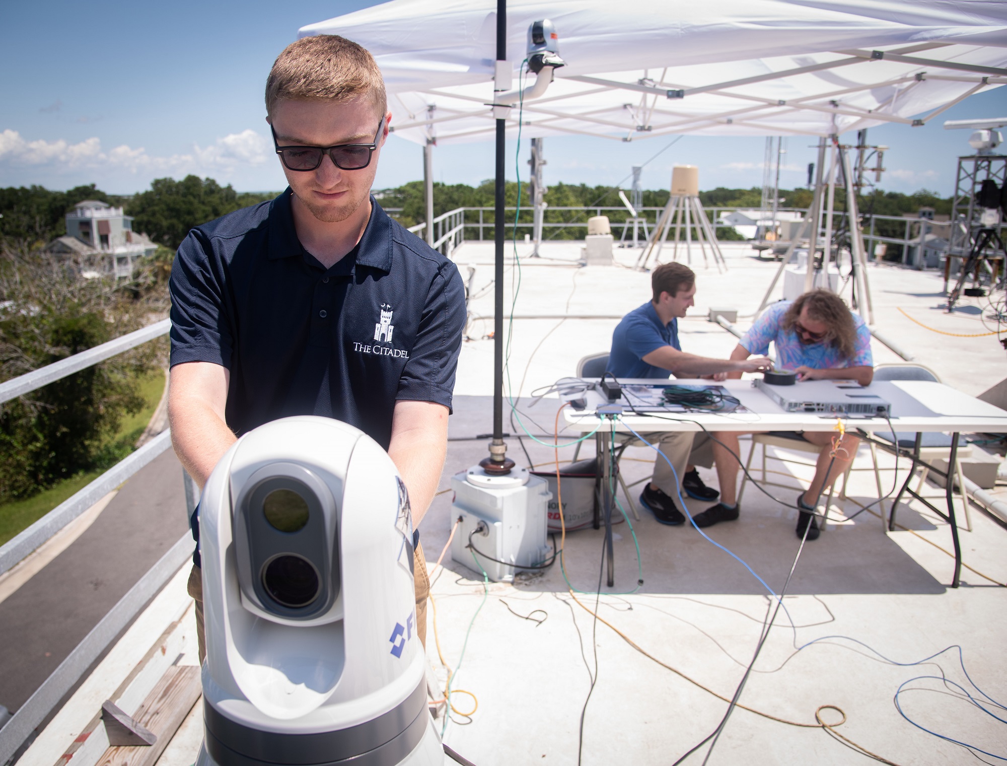 The Naval Information Warfare Center (NIWC) Atlantic team spent a few days at the Sullivan’s Island facility testing 5G communication devices over open water. Using a static tropospheric scatter (troposcatter) system located at the main facility and a 27-inch antenna mounted to a moving 35-foot boat, the team tested how far a 5G signal from the shore could be extended out to sea.
