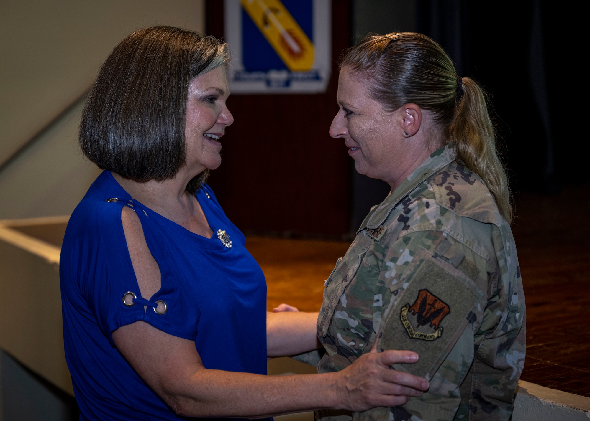 Kristen Christy, left, an international resilience expert, talks with an Airman assigned to the 4th Fighter Wing after conducting a resiliency chat at Seymour Johnson Air Force Base, North Carolina, Aug. 29, 2023. Christy came to Seymour Johnson AFB to talk with Airmen about resilience in preparation for National Suicide Prevention and Awareness month in September. (U.S. Air Force photo by Senior Airman David Lynn)