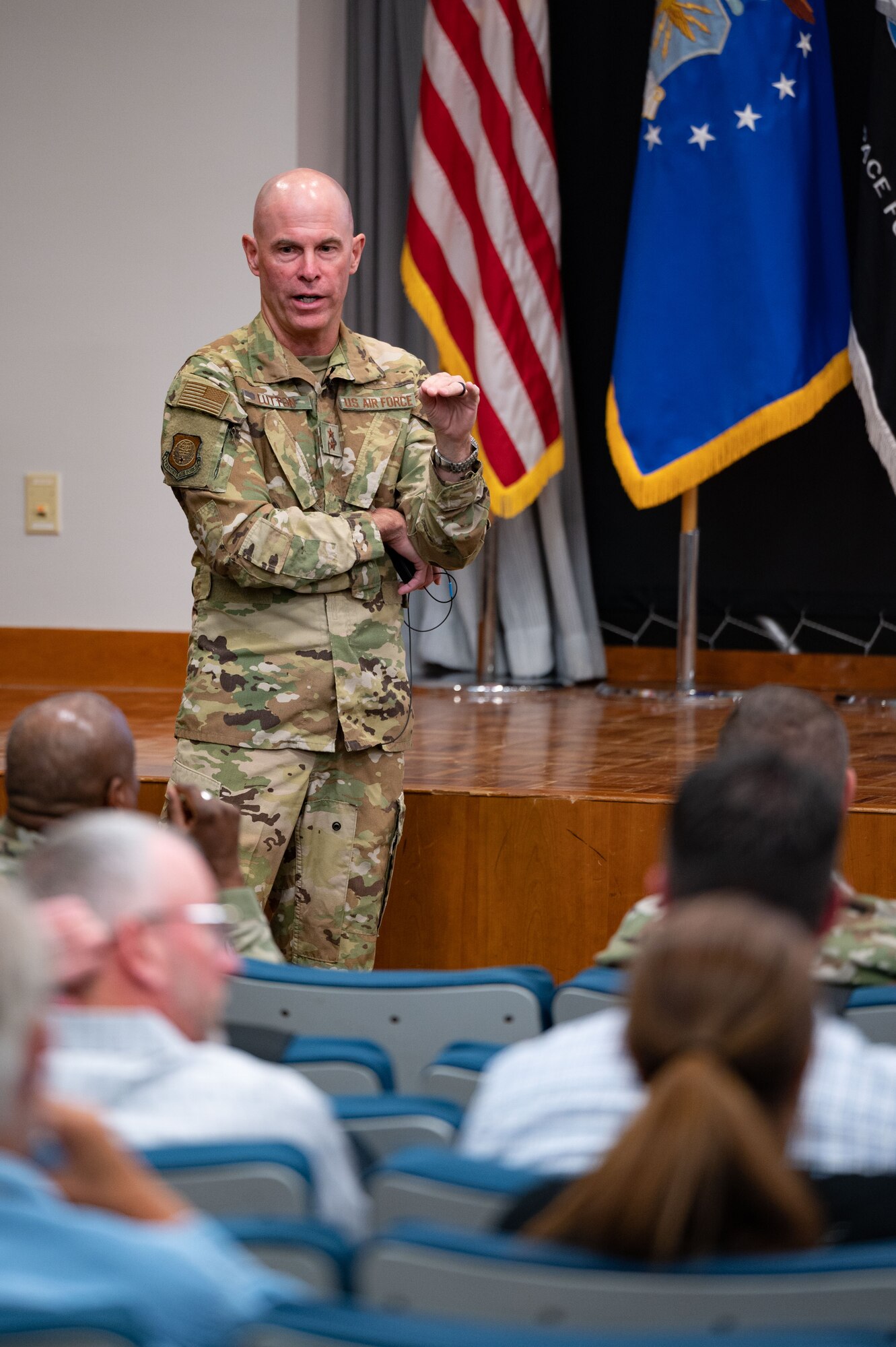 U.S. Air Force Maj. Gen. Micheal Lutton engages with members of the Space Force community at a townhall meeting at Peterson Space Force Base, Colorado, August 24, 2023.  Lutton, who leads the 20th Air Force, Air Force Global Strike Command,  answered questions about the Missile Community Cancer Study.  Historically, the Missile and Space communities have been closely linked, and many Guardians previously served as Air Force missileers.  (U.S. Space Force photo by Dave Grim)