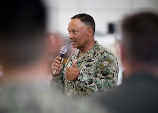 Fleet Master Chief Delbert Terrell Speaks to VP-9 Sailors during all-hands call inside hangar bay