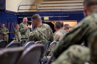 Chief of Naval Personnel Vice Adm. Rick Cheeseman responds to a Sailor’s question during a Town Hall meeting