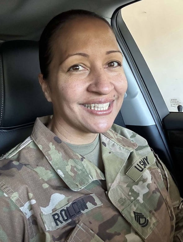 Female Soldier posed for a photo in a car.