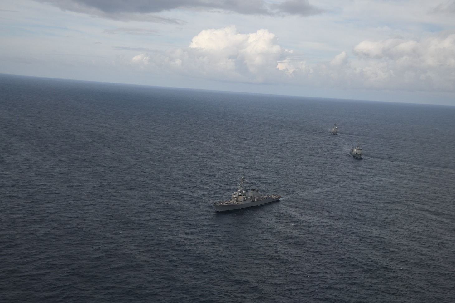 Japanese Maritime Self-Defense Force Maya-class guided missile destroyer Haguro (DDG-180); Arleigh Burke-class guided-missile destroyer USS Benfold (DDG 65); and Republic of Korea Sejong the Great-class destroyer Yulgok Yi (DDG-992) sail in formation during a trilateral exercise on Aug. 29.