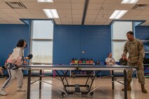 Airman 1st class Zhenglan Xu, 5th Comptroller Squadron financial management technician (left) and Senior Airman Rodney Robinson, 5th Comptroller Squadron financial management supervisor (right) play ping pong during the 2023 Summer Games at Minot Air Force Base, North Dakota, Aug. 25, 2023. The 5th Force Support Squadron hosts the annual Summer Games to encourage physical fitness, camaraderie and competition. (U.S. Air Force photo by Airman 1st Class Alyssa Bankston)