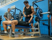 An Airman takes part in the bench pressing competition during the 2023 Summer Games at Minot Air Force Base, North Dakota, Aug. 25, 2023. The Summer Games are an annual event organized by the 5th Force Support Squadron to promote physical health and boost morale. (U.S. Air Force photo by Airman 1st Class Luis Gomez)