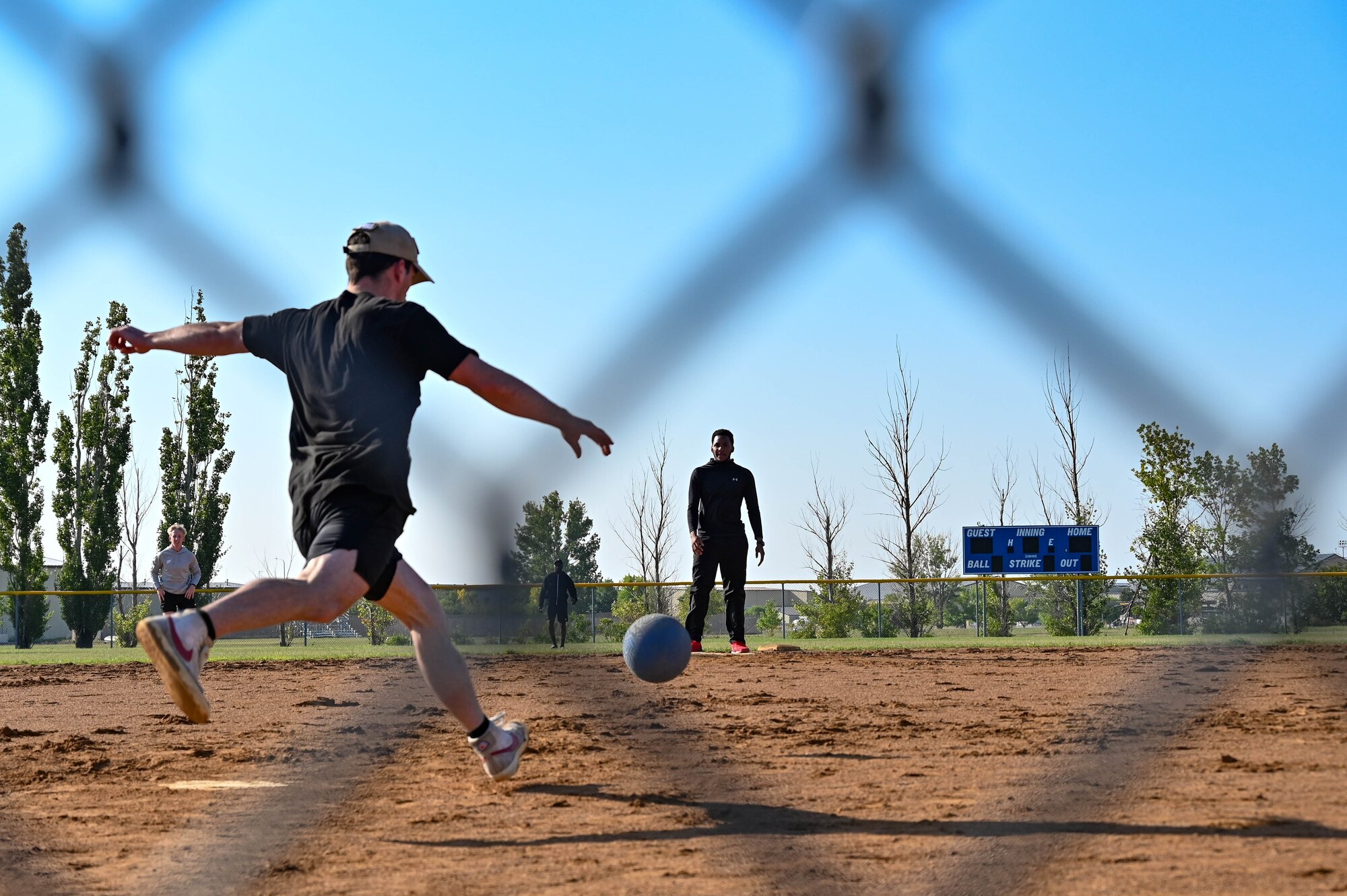 An Airman participating in the 2023 Summer Games at Minot Air Force Base, North Dakota, kicks a ball during the Kickball tournament Aug. 25, 2023. The annual Summer Games are put on by the 5th Force Support Squadron to promote physical health, camaraderie and competition. (U.S. Air Force photo by Senior Airman Zachary Wright)