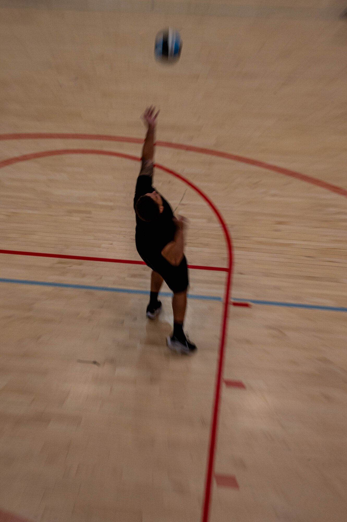 A Team Minot Airman prepares to serve volleyball during the Summer Games at Minot Air Force Base, North Dakota, Aug. 25, 2023. The  Summer Games have been taking place since 2015, promoting physical health, camaraderie and competition. (U.S. Air Force photo by Airman 1st Class Alexander Nottingham)