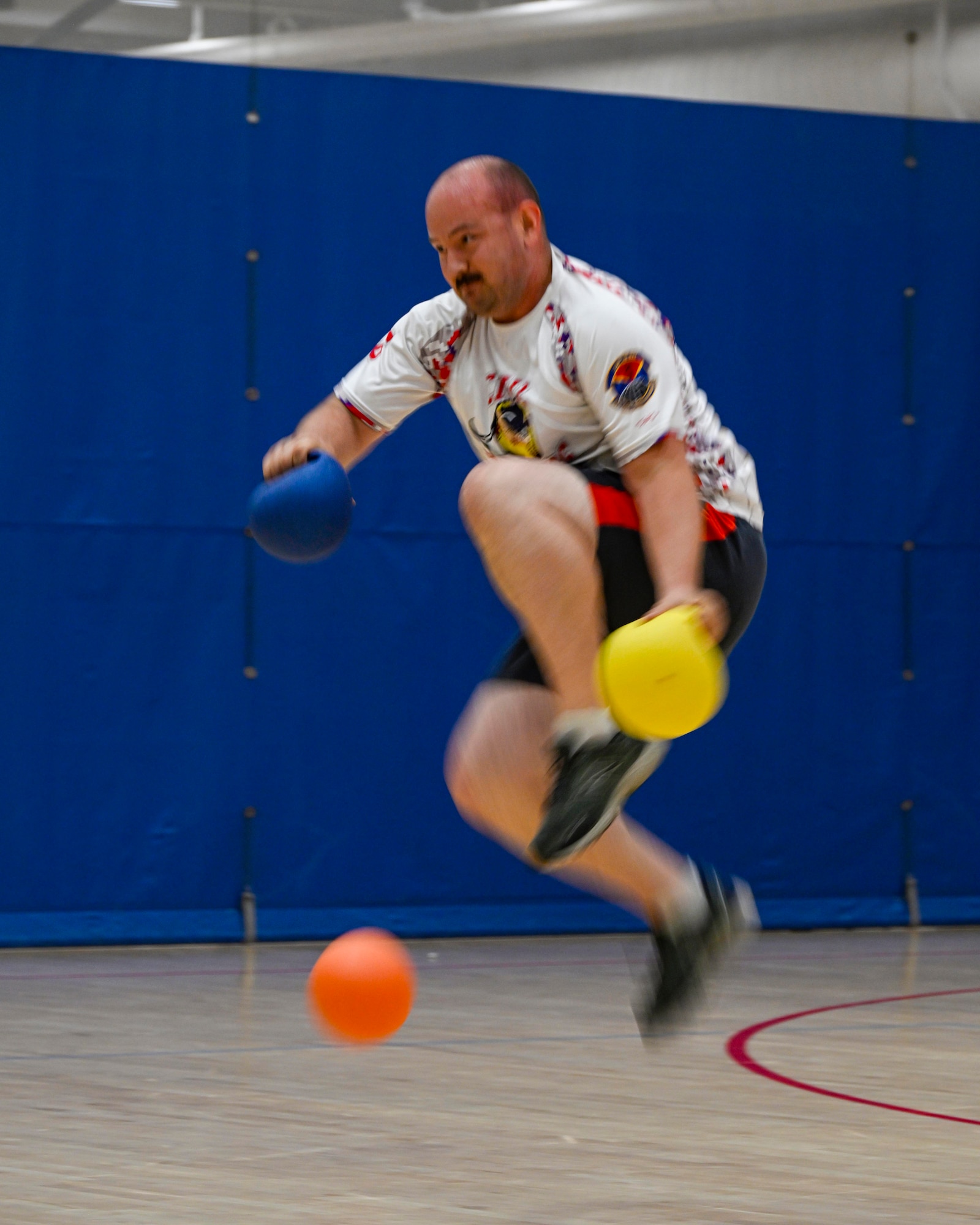A Team Minot Airman jumps out of the way as a ball is thrown during a dodgeball game at the Summer Games at Minot Air Force Base, North Dakota, Aug. 25, 2023. During the Summer Games, units from across the wing are encouraged to participate in morale activities such as basketball, soccer, or kickball. (U.S. Air Force photo by Senior Airman Caleb Kimmell)