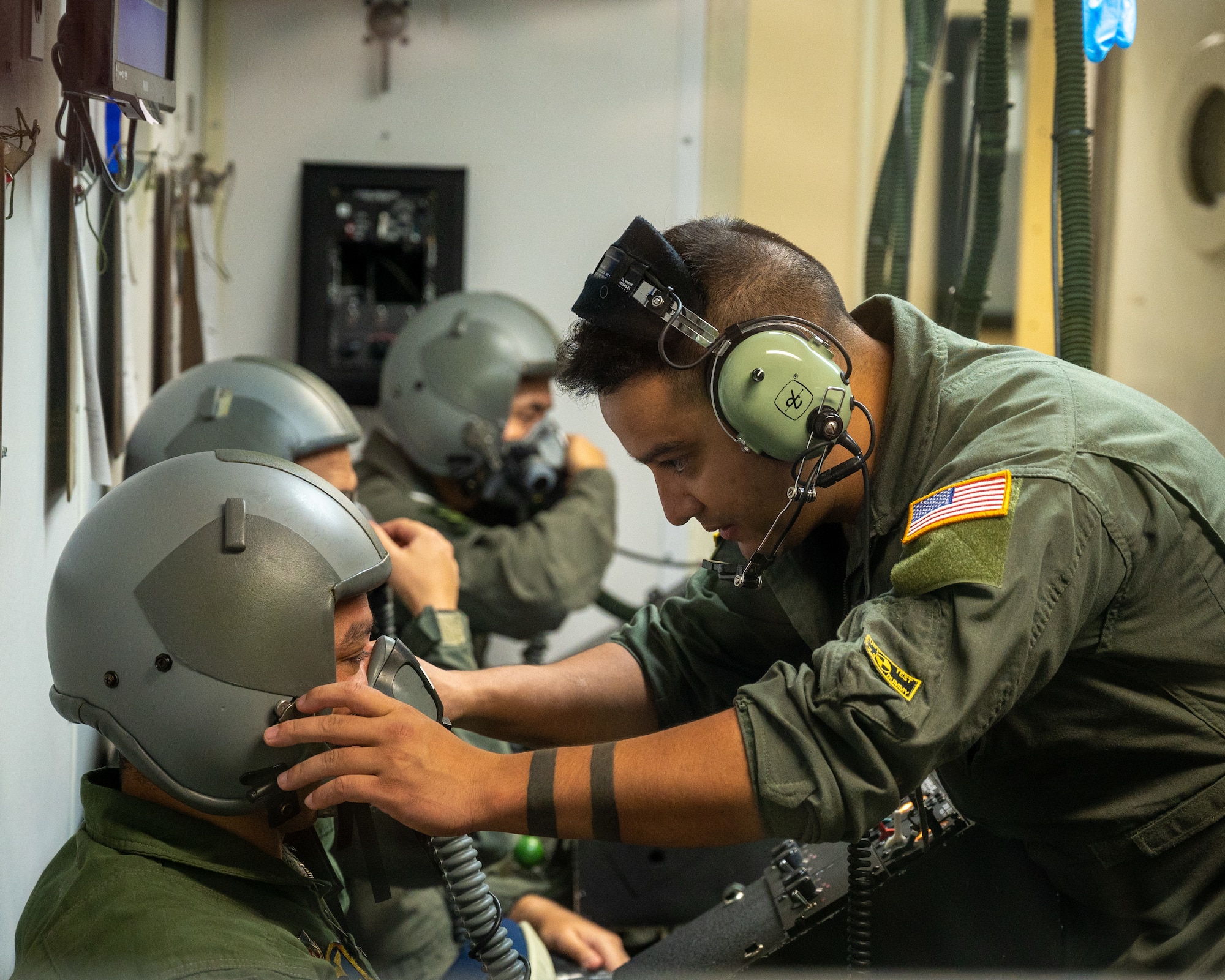 U.S. Air Force Senior Airman Erik Palaca, a 47th Operations Support Squadron aerospace physiology technician, prepares a pilot's oxygen mask for the altitude chamber at Laughlin Air Force Base, Texas, Aug. 14, 2023. A pilot's oxygen mask must have a good seal before going up to altitude, ensuring they receive enough air to maintain consciousness. (U.S. Air Force photo by Senior Airman Nicholas Larsen)
