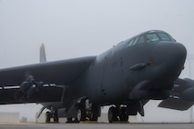 A B52-H Stratofortress, assigned to the 69th Bomb Squadron, waits in the main parking area for the morning's pre-flight routines at Minot Air Force Base, North Dakota, Aug. 24, 2023. For more than 60 years, B-52s have been the backbone of the strategic bomber force for the United States. (U.S. Air Force photo by Airman 1st Class Alexander Nottingham)