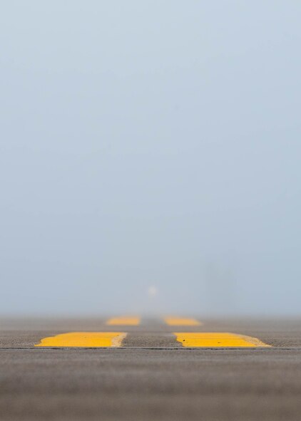 An area of the main parking area sits empty after a B52-H Stratofortress taxis away at Minot Air Force Base, North Dakota, Aug. 24, 2023. During extreme foggy conditions the airfield is brightly illuminated to ensure the safety of all jets and personnel. (U.S. Air Force photo by Airman 1st Class Alexander Nottingham)