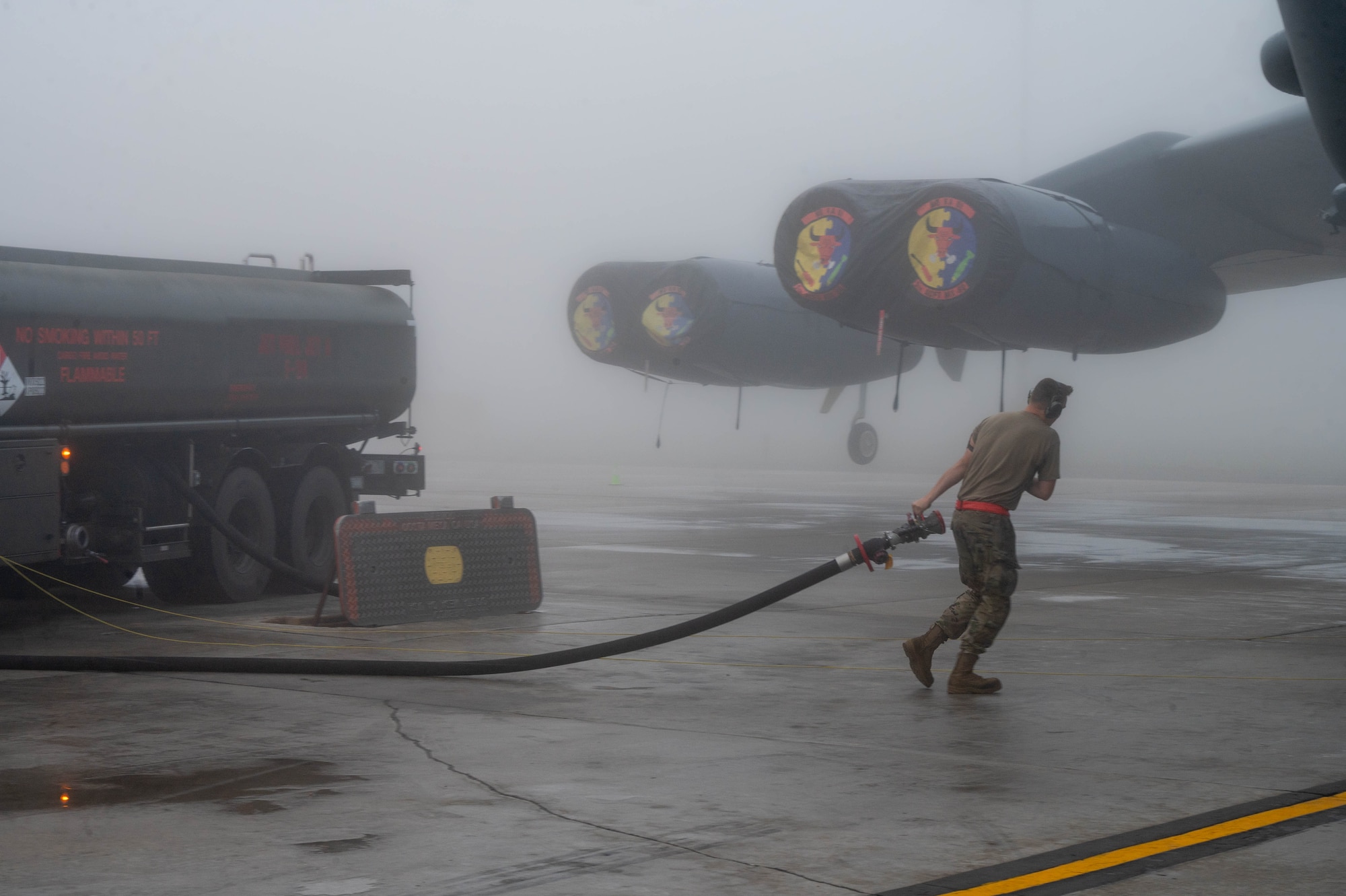 A 5th Bomb Wing fuels team member prepares to fuel a B52-H Stratofortress at Minot Air Force Base, North Dakota, Aug. 24, 2023. Having a fuel capacity of 312,197 pounds, the fuels team works around the clock to ensure the B52-H is prepared whenever and wherever it is needed. (U.S. Air Force photo by Airman 1st Class Alexander Nottingham)