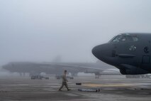 A 5th Bomb Wing crew chief performs the morning's pre-flight routines on a B52-H Stratofortress at Minot Air Force Base, North Dakota, Aug. 24, 2023. at Minot Air Force Base, North Dakota, Aug. 24, 2023. It’s the responsibility of crew chiefs to ensure that every component of these high performance aircrafts are maintained to precise standards. (U.S. Air Force photo by Airman 1st Class Alexander Nottingham)