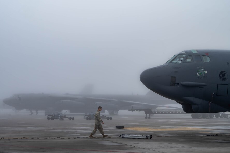 A 5th Bomb Wing crew chief performs the morning's pre-flight routines on a B52-H Stratofortress at Minot Air Force Base, North Dakota, Aug. 24, 2023. at Minot Air Force Base, North Dakota, Aug. 24, 2023. It’s the responsibility of crew chiefs to ensure that every component of these high performance aircrafts are maintained to precise standards. (U.S. Air Force photo by Airman 1st Class Alexander Nottingham)