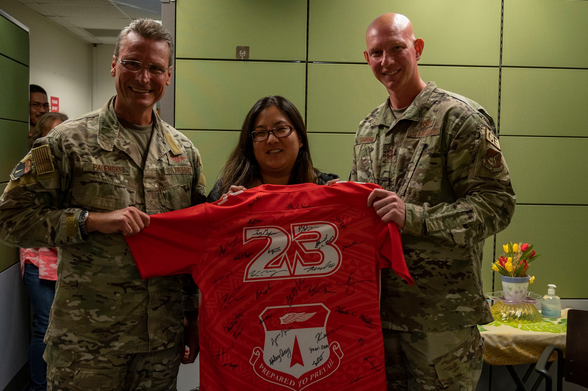 Kourtney Eay, a budget analyst with the 36th Comptroller Squadron, receives the Linebacker of the Week Award from U.S. Air Force Brig. Gen. Paul Fast, commander of the 36th Wing, and U.S. Air Force Chief Master Sgt. Donald McNair, the senior enlisted leader of the 36th Civil Engineering Squadron, at Andersen Air Force Base, Guam, Aug. 23, 2023. The Team Andersen Linebacker of the Week recognizes outstanding enlisted, officer, civilian and total force personnel who have had an impact on achieving Team Andersen’s mission, vision and priorities. (U.S. Air Force photo by Airman 1st Class Emily Saxton)