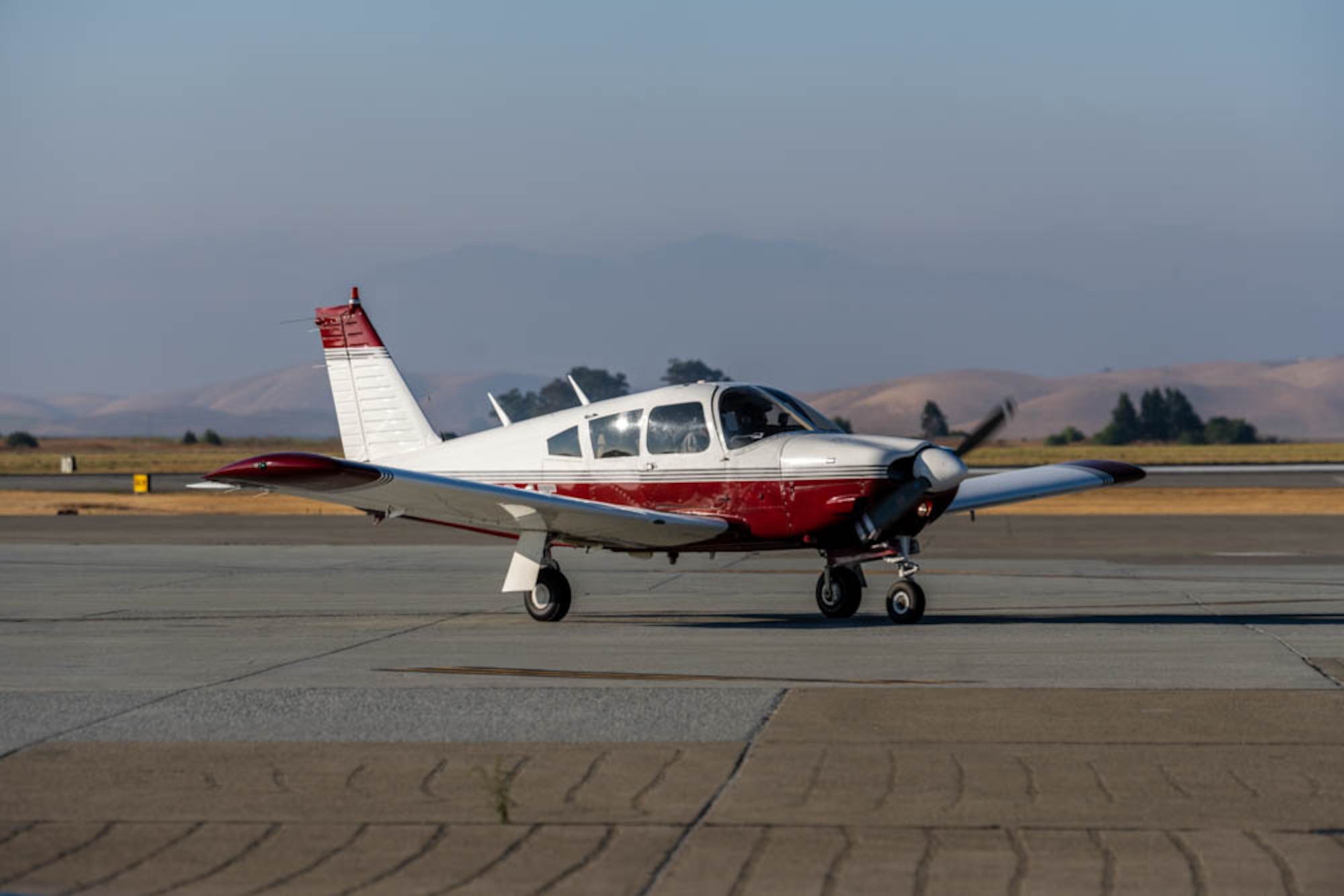 small plane lands on runway