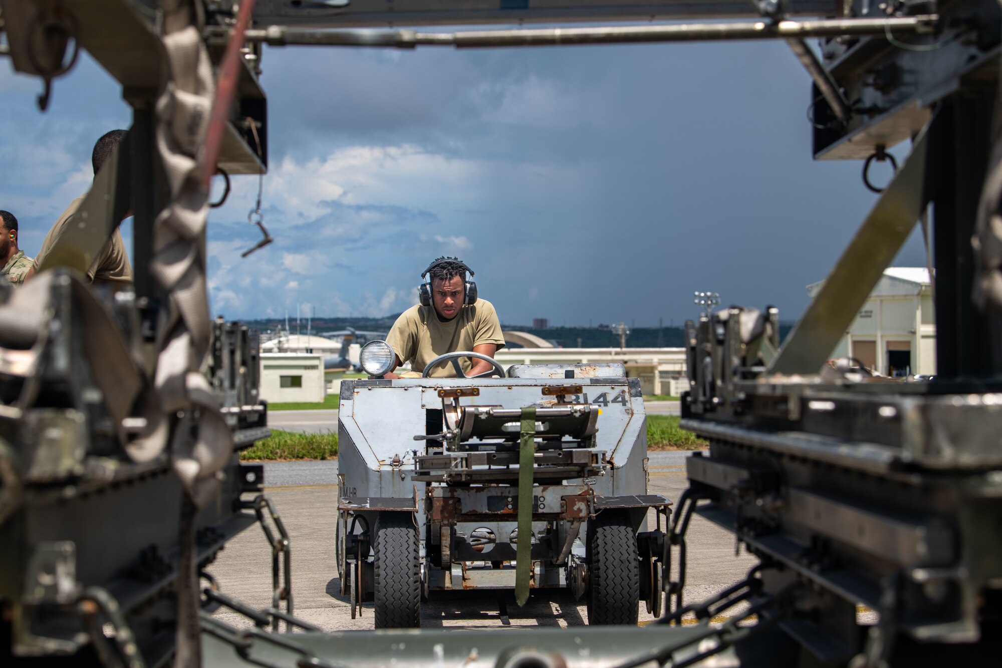 Airman prepares to load weaponry onto an F-15E Strike Eagle during a weapons load competition.