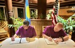 As part of a continued commitment to enhancing maritime governance and promoting regional sovereignty, representatives of the United States, Rear Adm. Michael Day, and the Republic of Palau, President Surangel S. Whipps, Jr., sign an expanded bilateral law enforcement agreement on Aug. 23, 2023, on the sidelines of the Joint Heads of Pacific Security conference in Palau. (Photo courtesy U.S. Embassy)