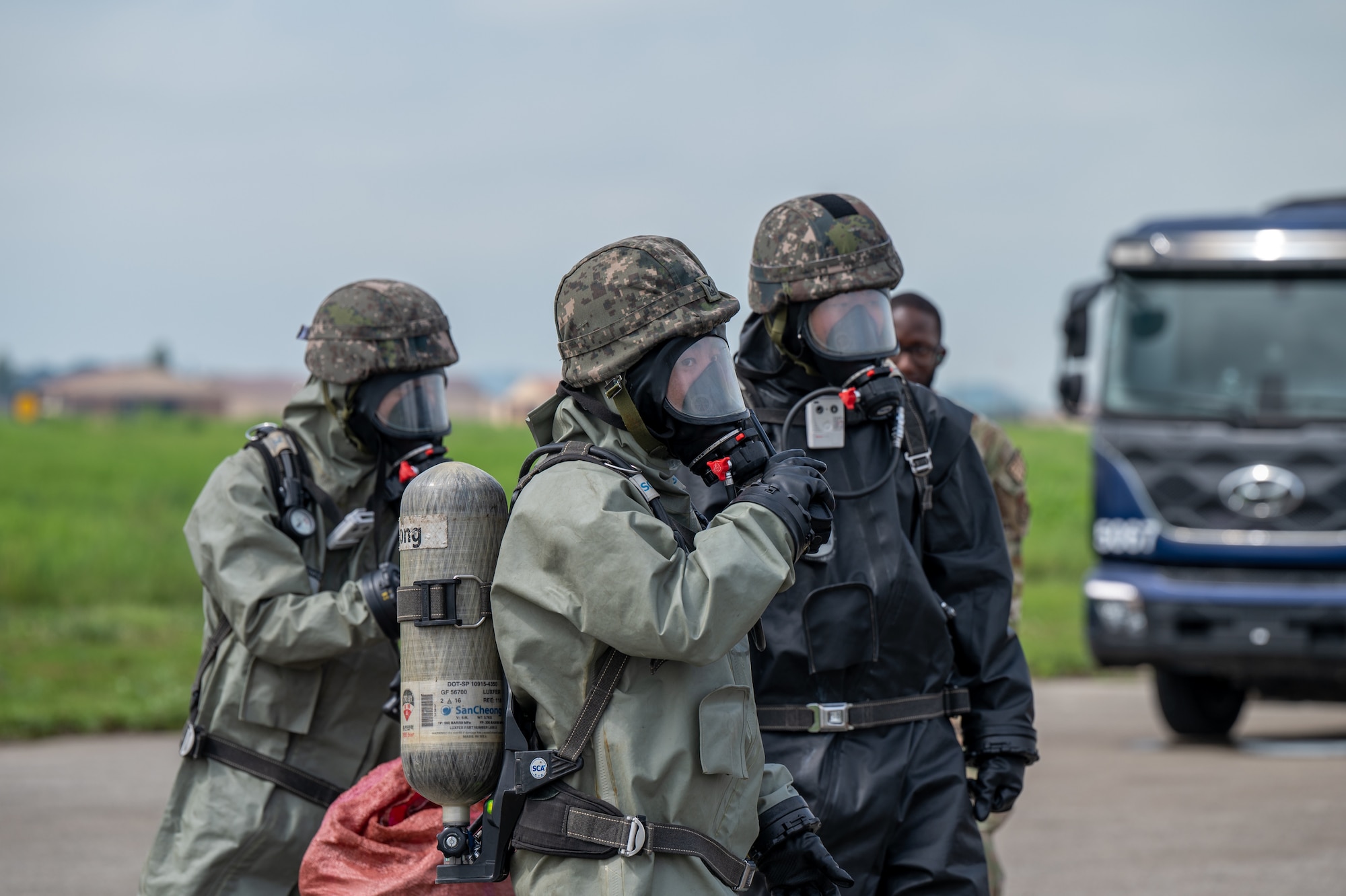 Republic of Korea Army Soldiers Cpl. Jung Yoon Pil, Staff Sgt. Kim Hyung Seop, and Sgt. Lee Do Yoon, 51st Infantry Division Chemical, Biological, Radiological and Nuclear Support Unit members, respond to a CBRN threat during a combined forces training at Osan Air Base, ROK, Aug. 24, 2023.