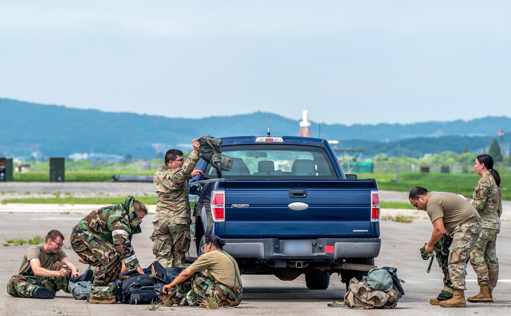 U.S. Air Force chemical, biological, radiological and nuclear response Airmen from the 51st Civil Engineer Squadron don mission oriented protective posture gear during a routine combined forces training at Osan Air Base, Republic of Korea, Aug. 24, 2023.