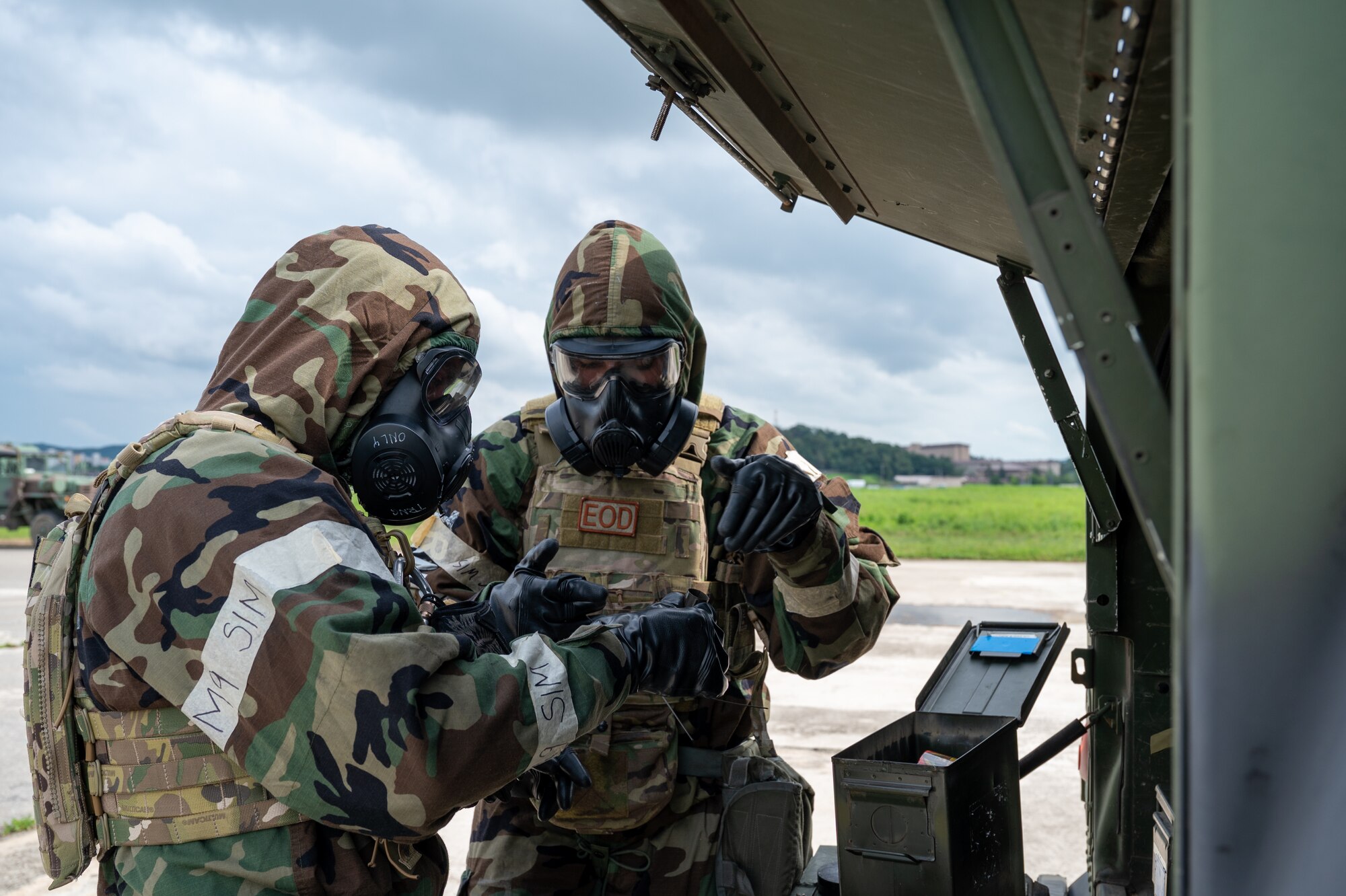 U.S. Air Force Tech. Sgt. Kyle Gooderham and Senior Airman Eric Gaussman, 51st Civil Engineer Squadron explosive ordnance disposal team, respond to an unexploded ordinance call during a combined forces chemical, biological, radiological and nuclear training at Osan Air Base, Republic of Korea, Aug. 24, 2023.
