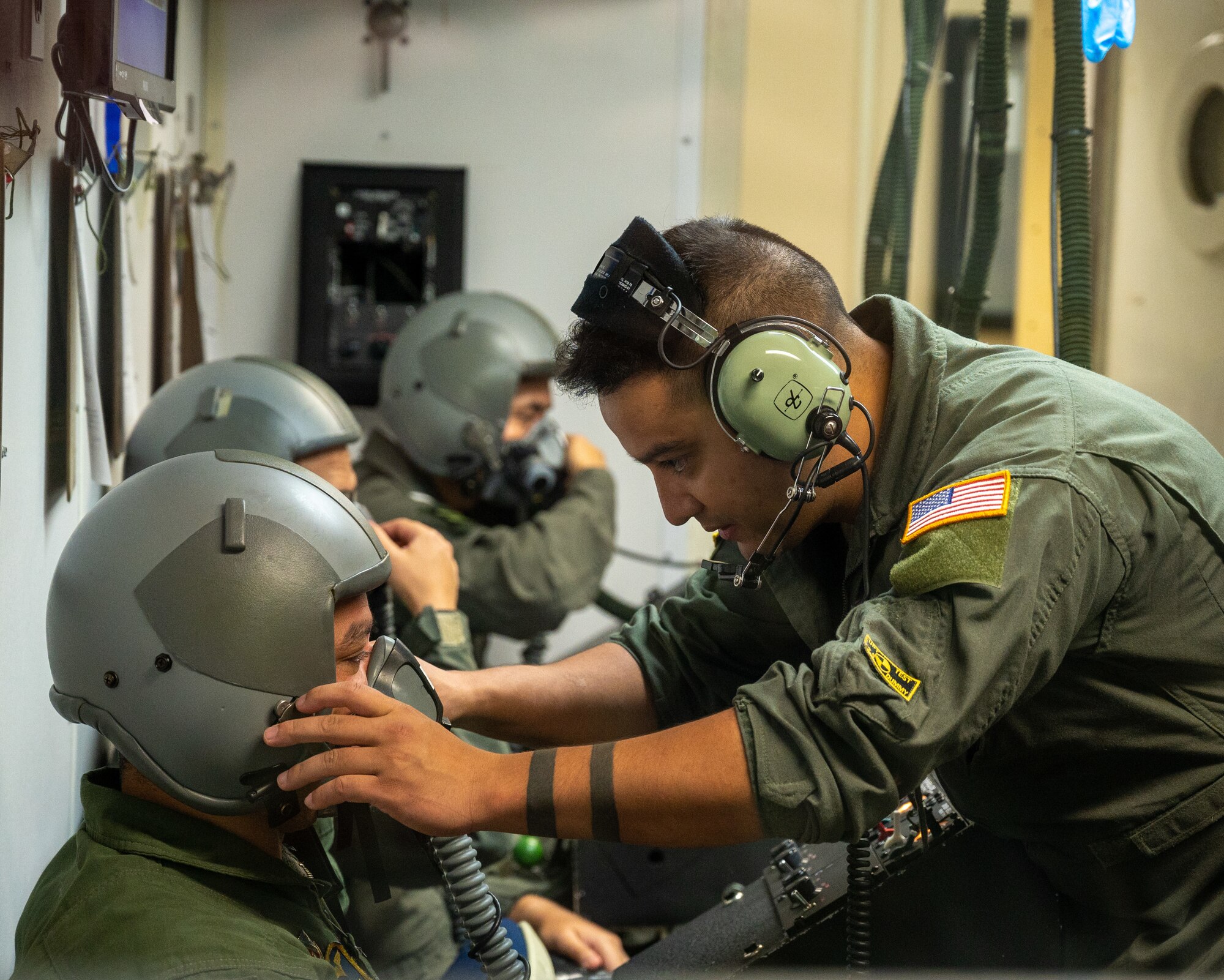U.S. Air Force Senior Airman Erik Palaca, a 47th Operations Support Squadron aerospace physiology technician, prepares a pilot's oxygen mask for the altitude chamber at Laughlin Air Force Base, Texas, Aug. 14, 2023. A pilot's oxygen mask must have a good seal before going up to altitude, ensuring they receive enough air to maintain consciousness. (U.S. Air Force photo by Senior Airman Nicholas Larsen)