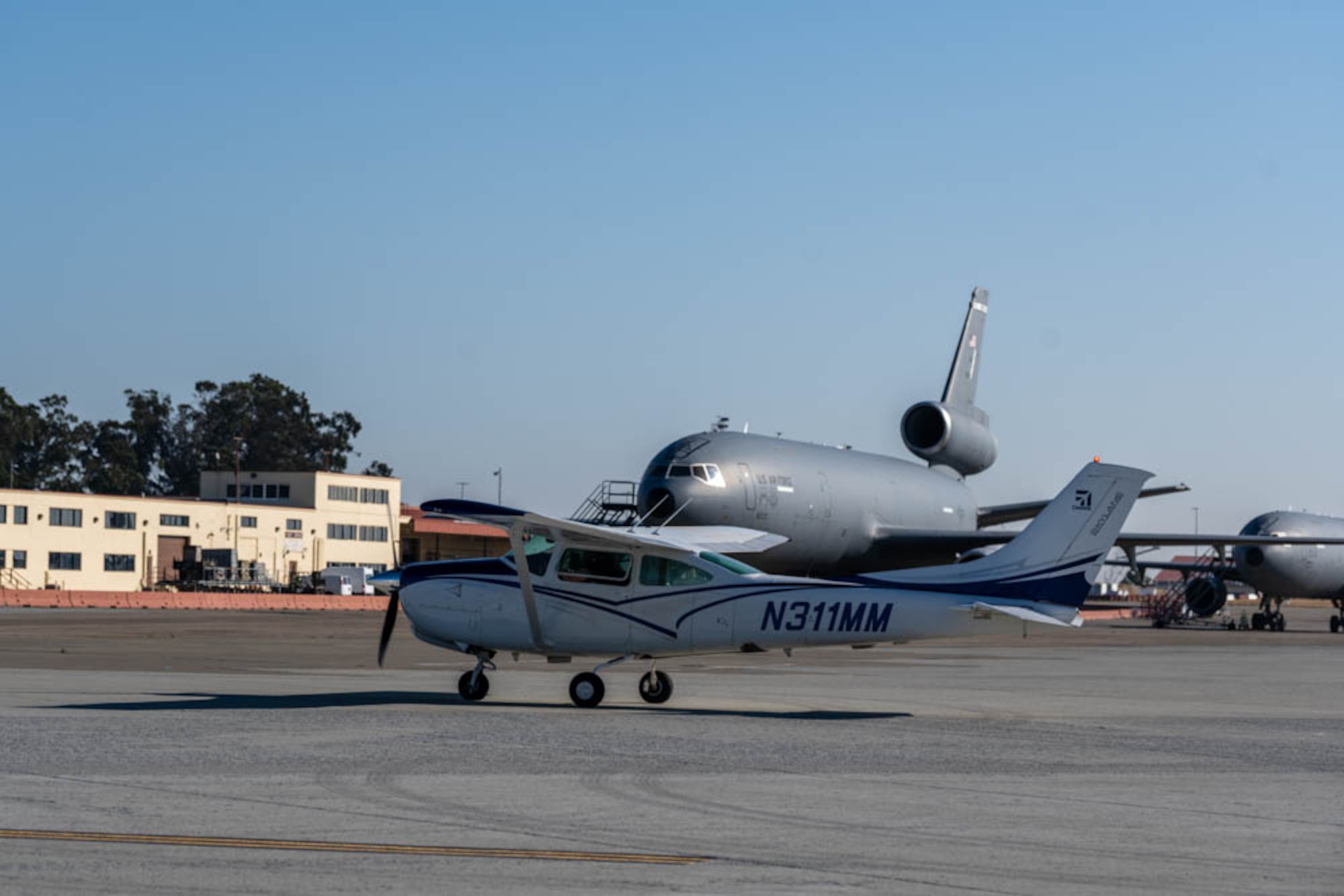 plane taxis to parking spot on flightline