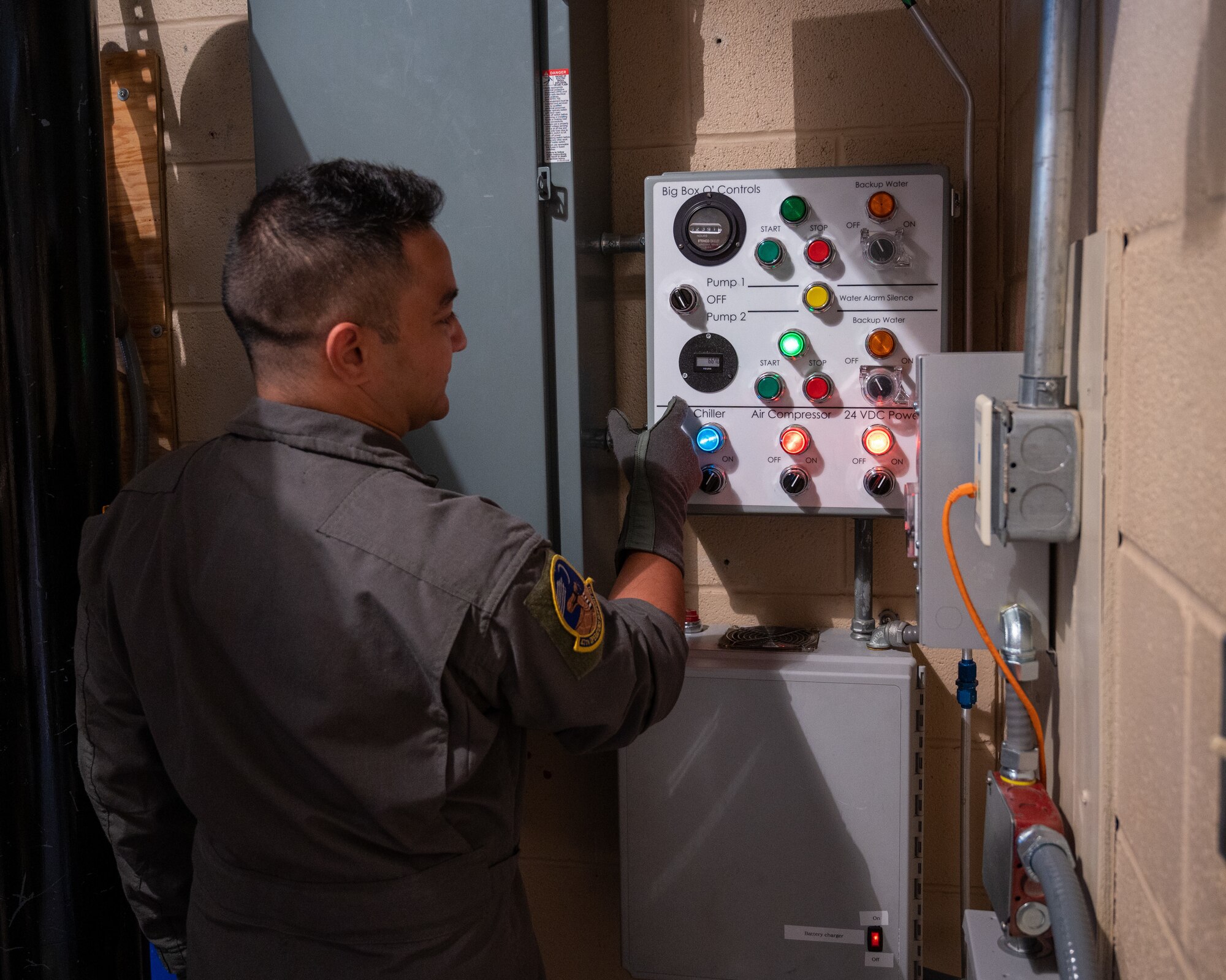 U.S. Air Force Senior Airman Erik Palaca, a 47th Operations Support Squadron aerospace physiology technician, checks the control box for the altitude chamber at Laughlin Air Force Base, Texas, Aug. 14, 2023. Despite Laughlin's altitude chamber being built in 1952, upgrades to the support equipment have kept the chamber up to date and able to support pilots in the modern age. (U.S. Air Force photo by Senior Airman Nicholas Larsen)