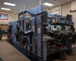 U.S. Air Force altitude chamber technicians monitor the pilots and technicians inside during operations at Laughlin Air Force Base, Texas, Aug. 14, 2023. Throughout the entire mission, chamber technicians will keep a close eye on the status of the members inside, watching for any symptoms of altitude sickness; if symptoms occur operators will return the group to a previous altitude and check up on the affected member. (U.S. Air Force photo by Senior Airman Nicholas Larsen)