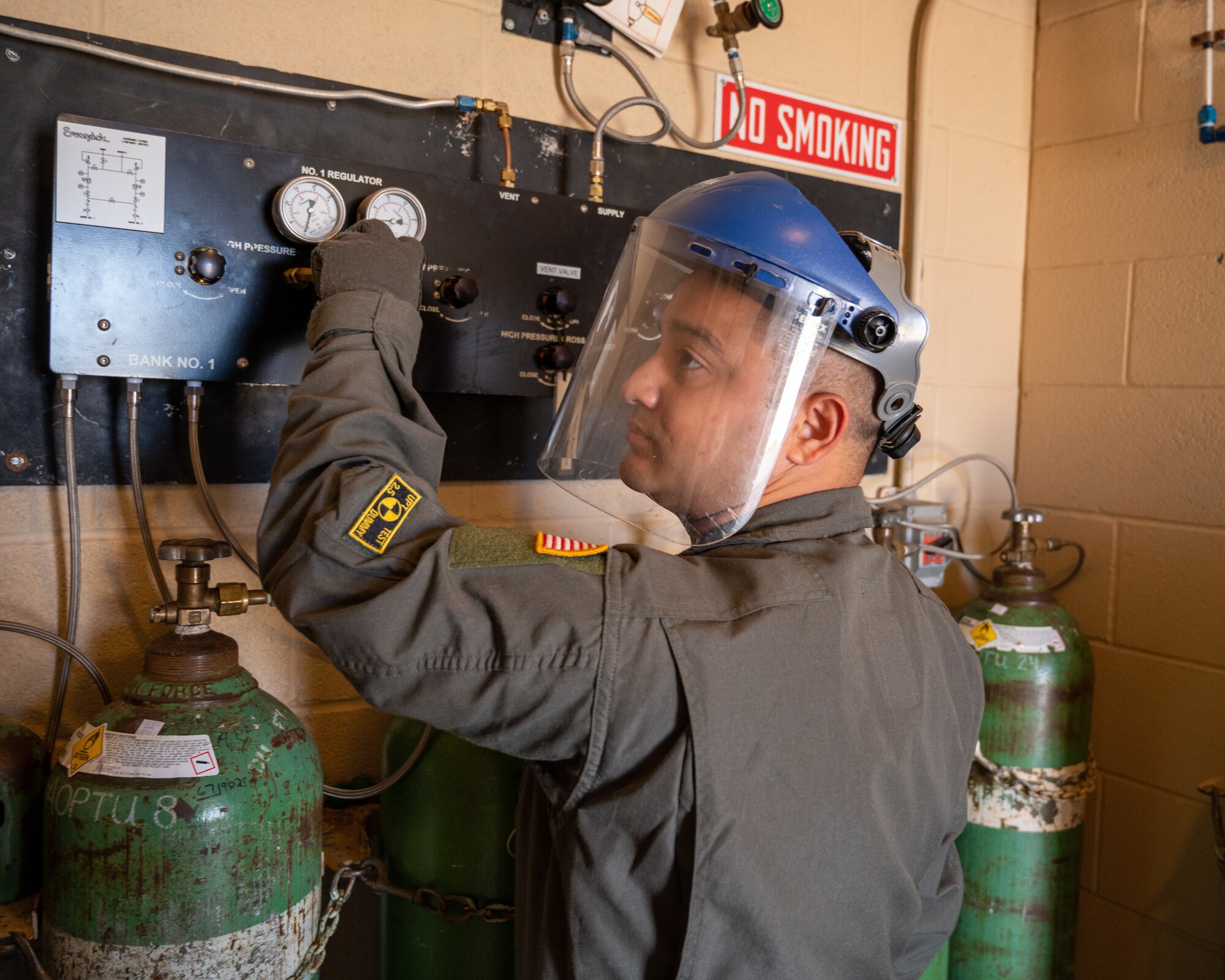 U.S. Air Force Senior Airman Erik Palaca, a 47th Operations Support Squadron aerospace physiology technician, prepares the air supplies for the altitude chamber at Laughlin Air Force Base, Texas, Aug. 14, 2023. Keeping the correct levels of oxygen is essential for the members inside, ensuring that members get to experience the correct levels of oxygen deprivation at each altitude. (U.S. Air Force photo by Senior Airman Nicholas Larsen)