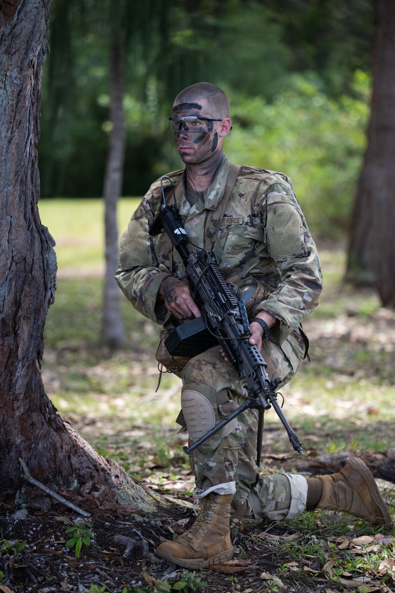 A Ranger Assessment Course student pulls security while conducting a battle drill, May 31, 2023, Schofield Barracks, Hawaii. The Air Force RAC is a 19-day course that is designed to assess the physical and mental toughness of Airmen and Guardians who are interested in attending Army Ranger School. (U.S. Air Force photo by Tech. Sgt. Hailey Haux)