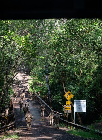 Ranger Assessment Course students march up the largest hill—known as Big Ivan—after completing the obstacle course, May 29, 2023, Schofield Barracks, Hawaii. During the course the Airmen, Soldiers and Guardian worked together, further reinforcing the need to understand what it’s like to work in a joint environment and in turn how to better support one another once they return to their respective units. (U.S. Air Force photo by Tech. Sgt. Hailey Haux)