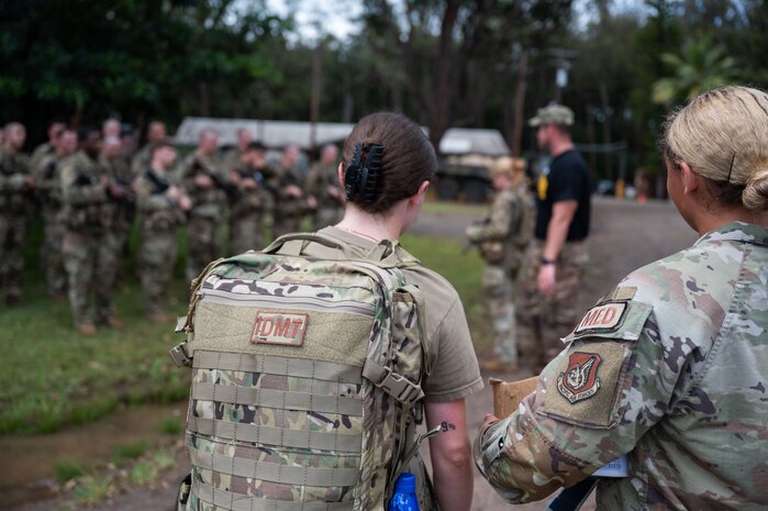15th Wing medical personnel assist the Army medics during the Ranger Assessment Course in ensuring ensure servicemembers are taken care of after a land navigation class, May 23, 2023. While navigating their way through the RAC, the Airmen, Guardian, and Soldiers were looked after by a team of joint force medics—further displaying how integrated the Air Force is with its Army counterparts. (U.S. Air Force photo by Tech. Sgt. Hailey Haux)