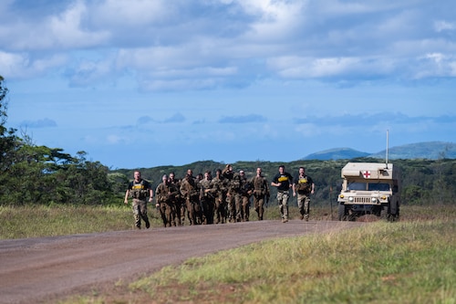 Ranger Assessment Course students conduct a run after completing the obstacle course, May 29, 2023, Schofield Barracks, Hawaii. While going through the RAC, students not only learned about the technical tactics, but they also conducted physical training and ruck marches to prepare them for the requirements at Ranger School. (U.S. Air Force photo by Tech. Sgt. Hailey Haux)