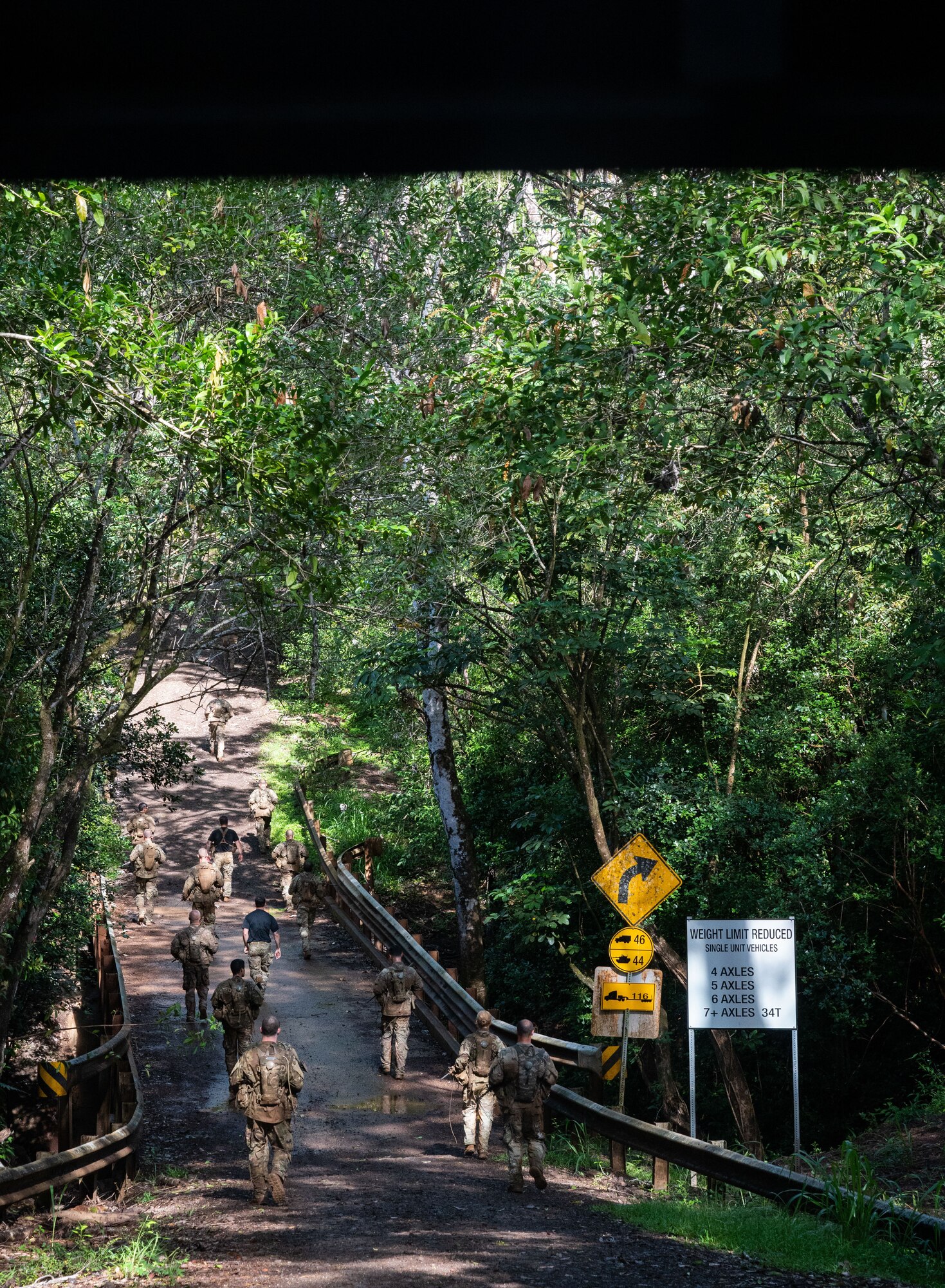 Ranger Assessment Course students march up the largest hill—known as Big Ivan—after completing the obstacle course, May 29, 2023, Schofield Barracks, Hawaii. During the course the Airmen, Soldiers and Guardian worked together, further reinforcing the need to understand what it’s like to work in a joint environment and in turn how to better support one another once they return to their respective units. (U.S. Air Force photo by Tech. Sgt. Hailey Haux)