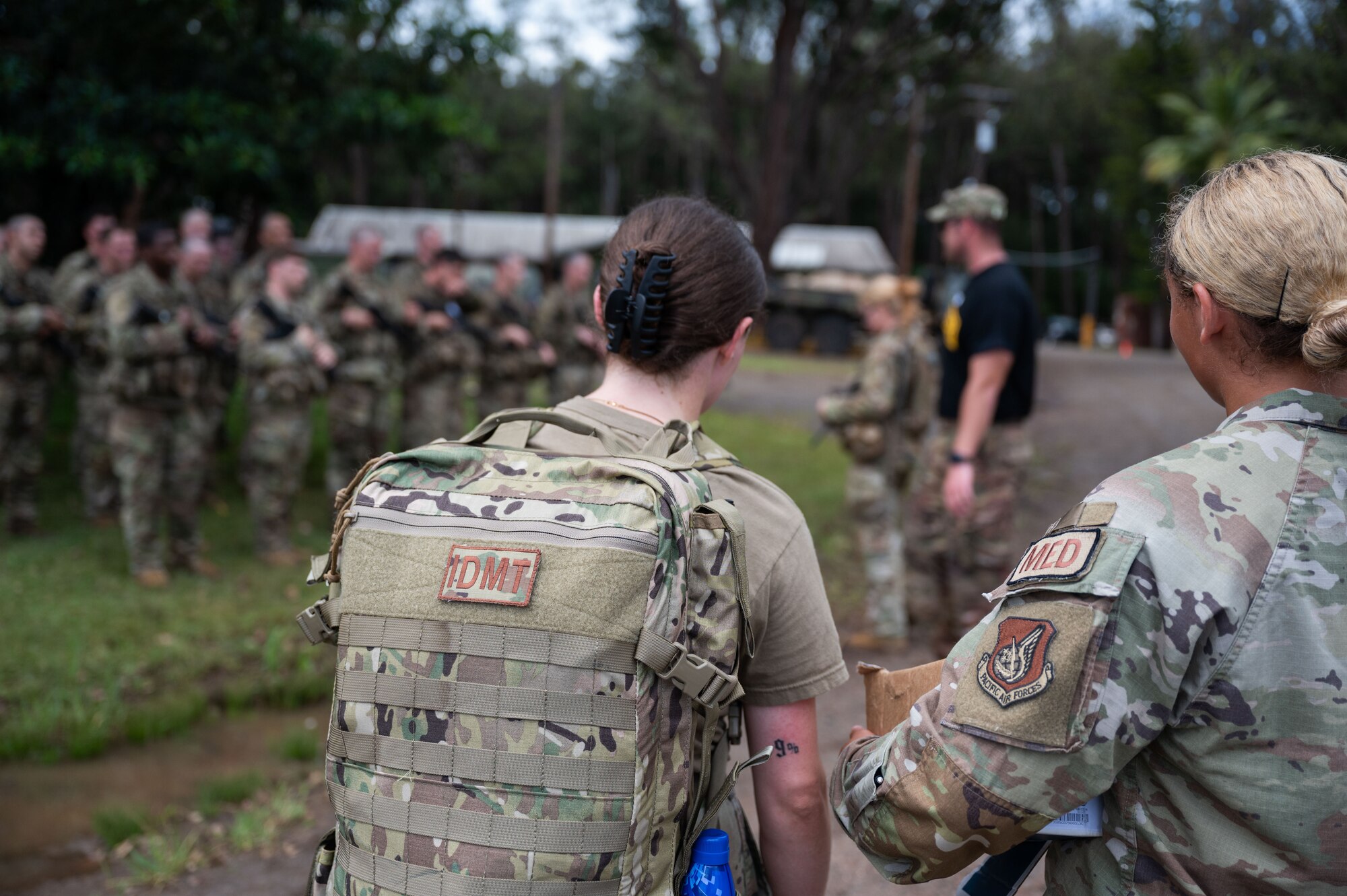 15th Wing medical personnel assist the Army medics during the Ranger Assessment Course in ensuring ensure servicemembers are taken care of after a land navigation class, May 23, 2023. While navigating their way through the RAC, the Airmen, Guardian, and Soldiers were looked after by a team of joint force medics—further displaying how integrated the Air Force is with its Army counterparts. (U.S. Air Force photo by Tech. Sgt. Hailey Haux)