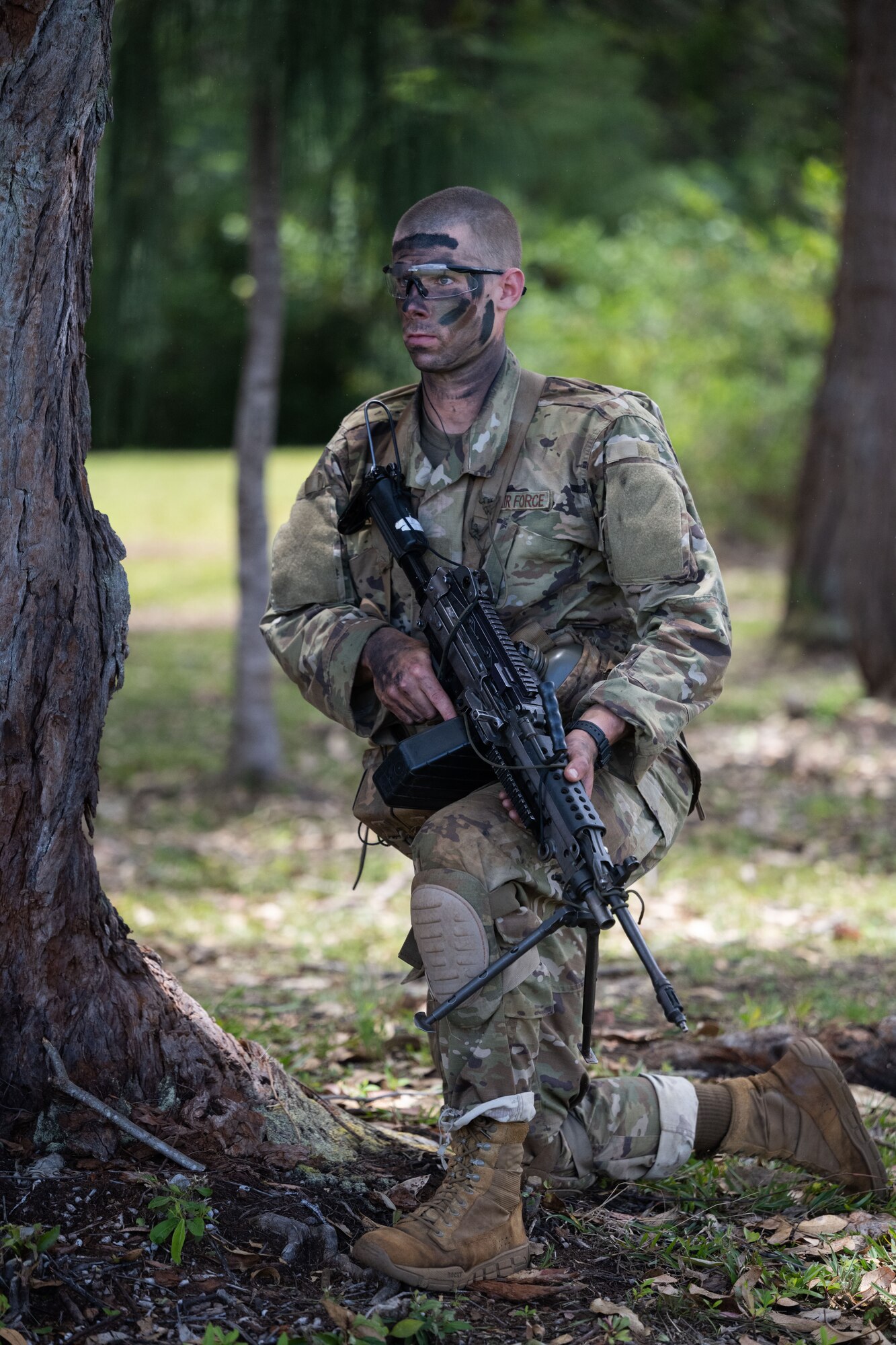 A Ranger Assessment Course student pulls security while conducting a battle drill, May 31, 2023, Schofield Barracks, Hawaii. The Air Force RAC is a 19-day course that is designed to assess the physical and mental toughness of Airmen and Guardians who are interested in attending Army Ranger School. (U.S. Air Force photo by Tech. Sgt. Hailey Haux)