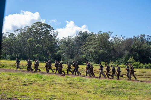 Ranger Assessment Course students conduct a run after completing the obstacle course, May 29, 2023, Schofield Barracks, Hawaii. Truly representing a joint force, there were service members from numerous Air and Space Force Specialty Codes and Army Military Occupational Specialties in the RAC. It ranged from Army infantry to Air Force medics and Space Force developmental engineer and included career fields like engineer officer, military police, contracting, security forces and others. (U.S. Air Force photo by Tech. Sgt. Hailey Haux)