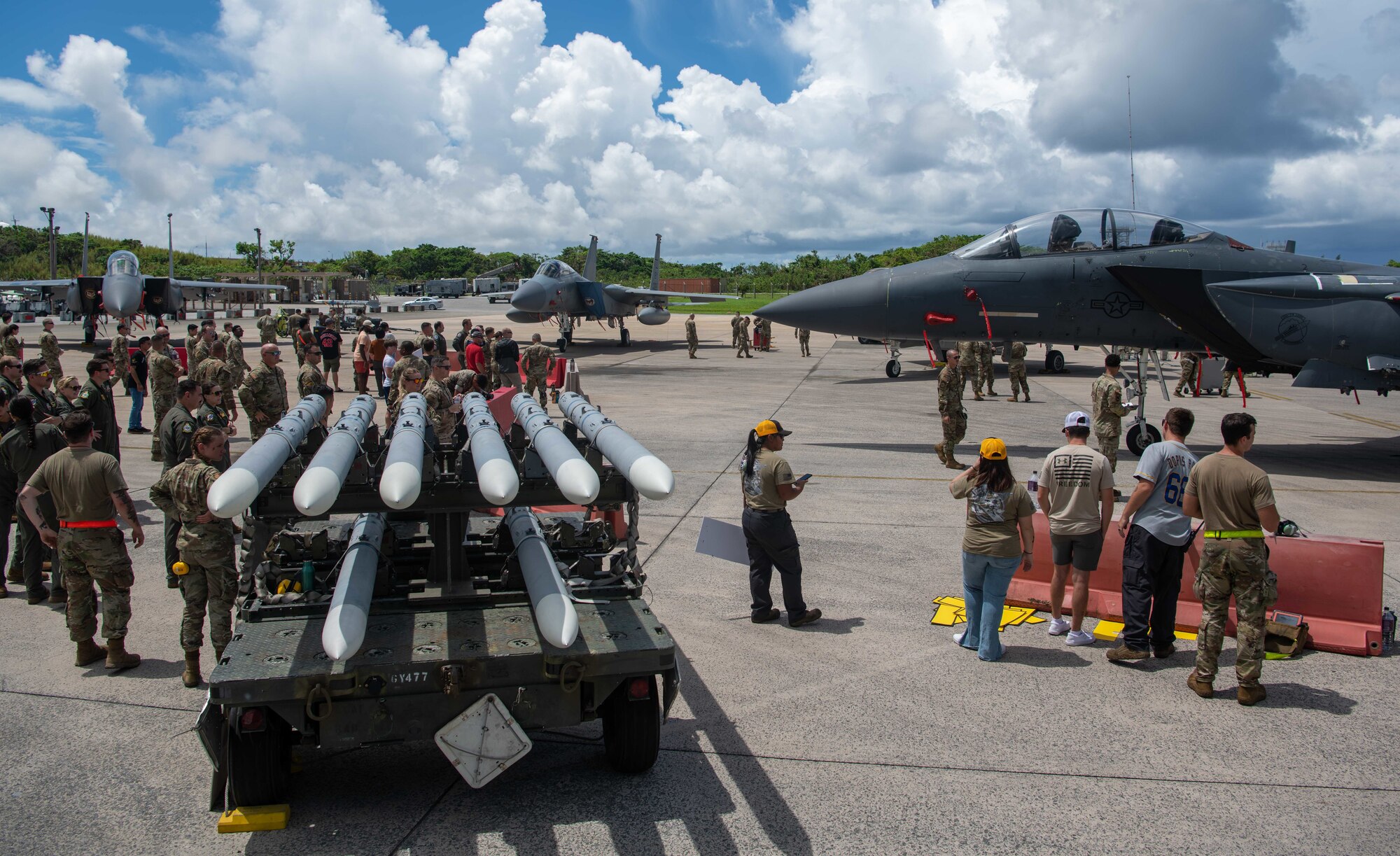 Airmen gather to watch the 18th Maintenance Group quarterly weapons load competition.