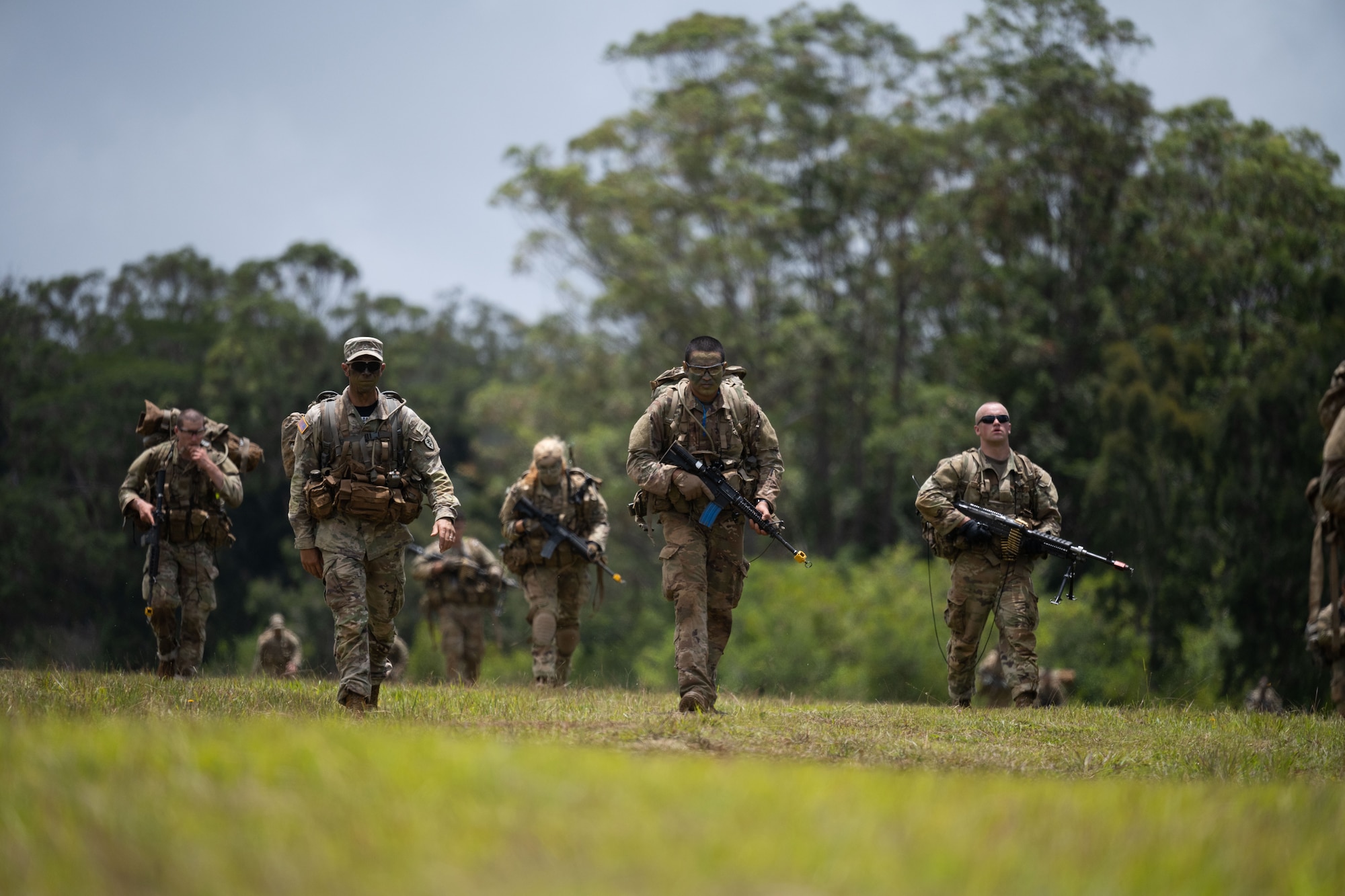 A U.S. Army Small Unit Ranger Tactics instructor walks alongside students, May 31, 2023. While going through the RAC, students not only learned about tactics, but they also conducted physical training and ruck marches to prepare them for the requirements at Ranger School. (U.S. Air Force photo by Tech. Sgt. Hailey Haux)