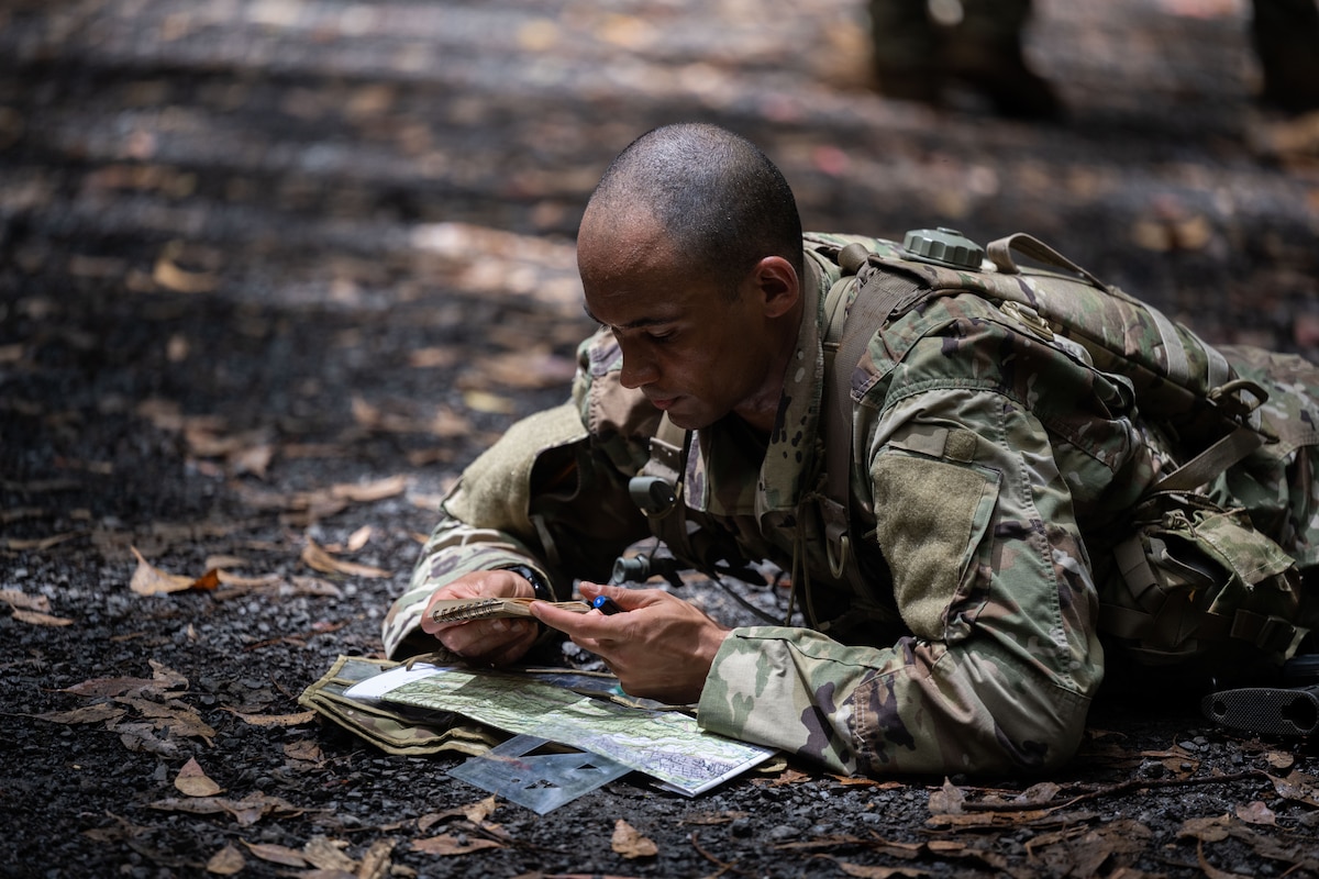 A Ranger Assessment Course student practices land navigation during the RAC, May 23, 2023, Schofield Barracks, Hawaii. The Air Force RAC is a 19-day course that is designed to assess the physical and mental toughness of Airmen and Guardians who are interested in attending Army Ranger School. (U.S. Air Force photo by Tech. Sgt. Hailey Haux)