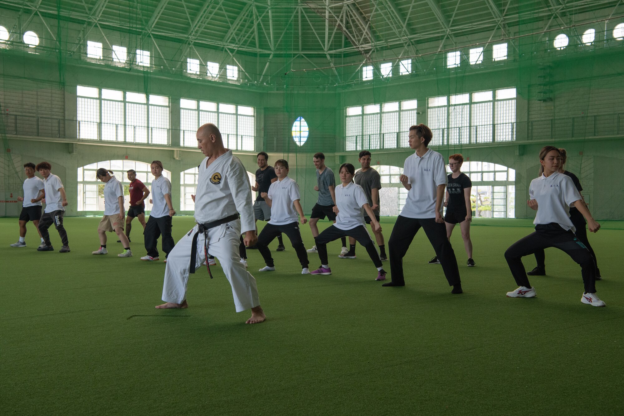 Volunteers and local students practice karate.
