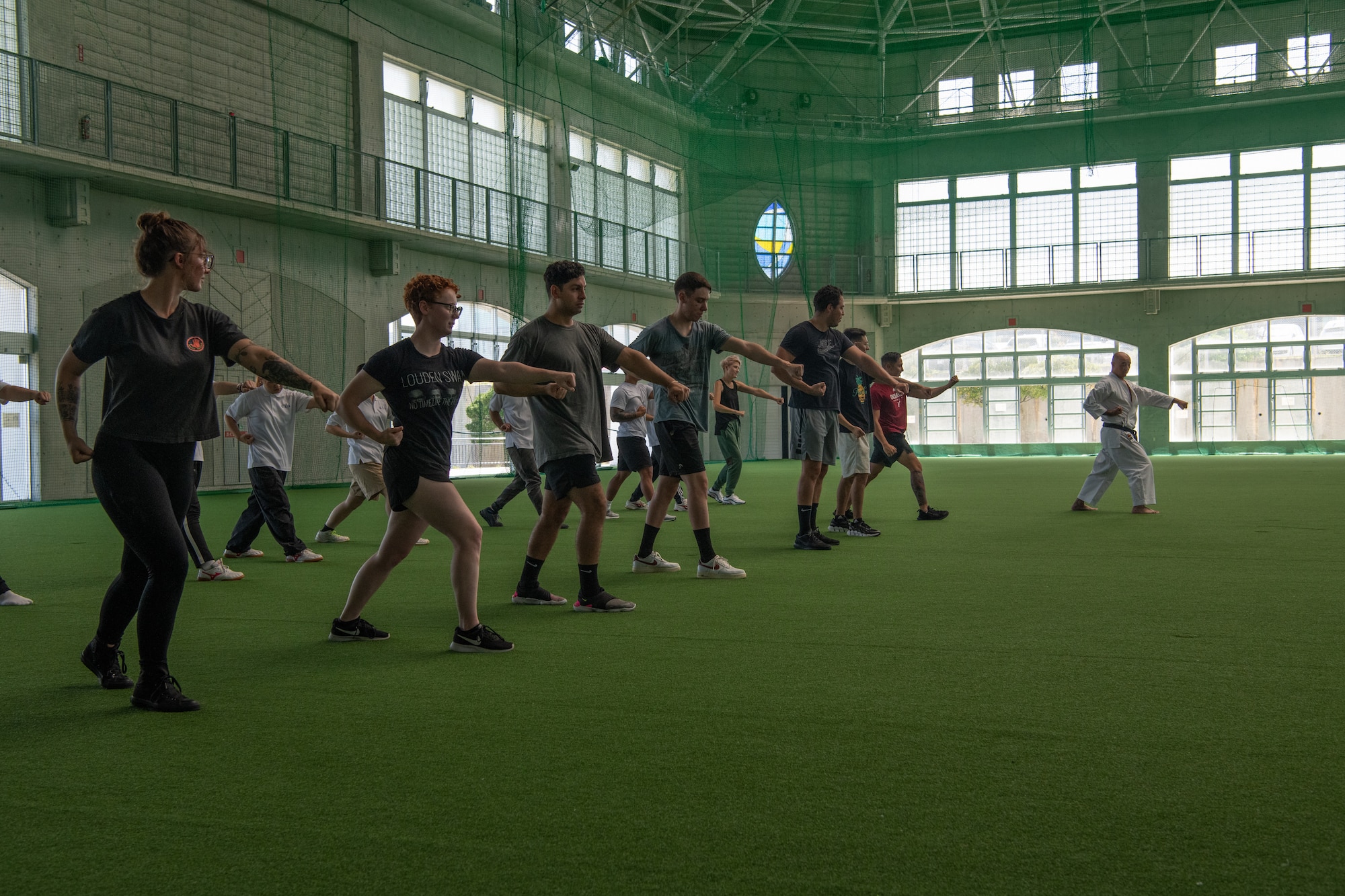 Volunteers and local students practice karate.