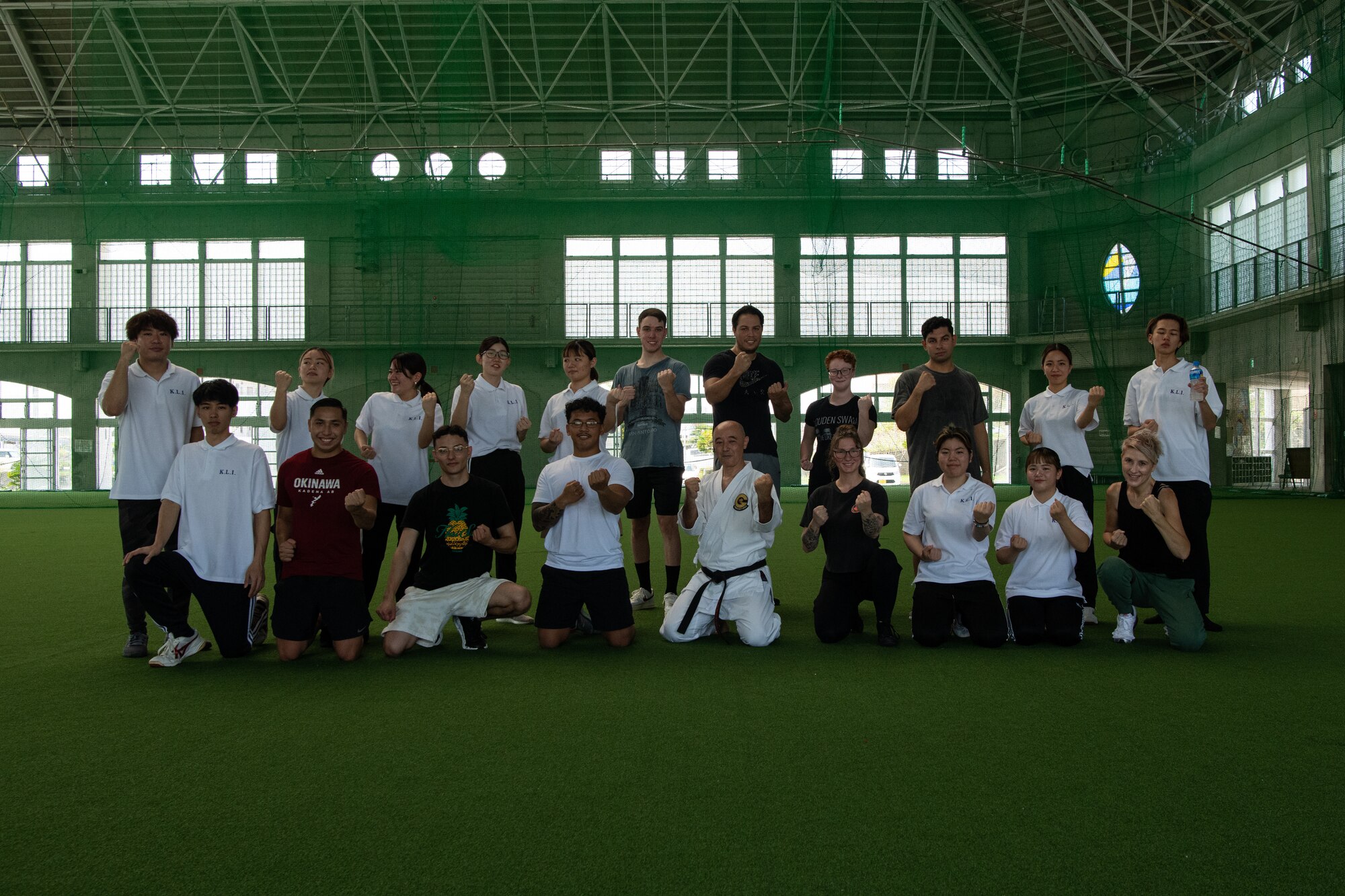 Volunteers and local students pose for a group photo.