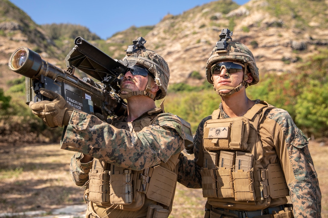 U.S. Marine Corps Lance Cpl. Isaac Gregory, left, and U.S. Marine Corps Pfc. Alan Molina, set security with an FIM-92 Stinger during Pololu Strike at Dillingham Airfield, Waialua, Hawaii, August 23, 2023. Pololu Strike is a 3d MLR exercise consisting of staff education, planning, and battalion-led field training. The training focuses on the education and development of 3d MLR and battalion staffs, deliberate planning repetitions, and execution of training and readiness standards in a field environment. Gregory and Molina are both low altitude-air defense gunners with 3d Littoral Anti-Air Battalion, 3d Marine Littoral Regiment, 3d Marine Division. Gregory is a native of Burleson, Texas. Molina is a native of Austin, Texas.