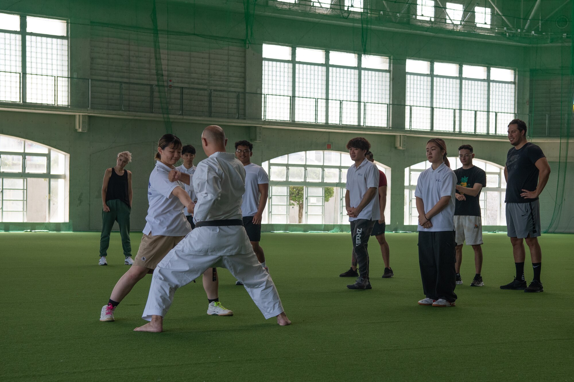 A karate instructor demonstrates a block.