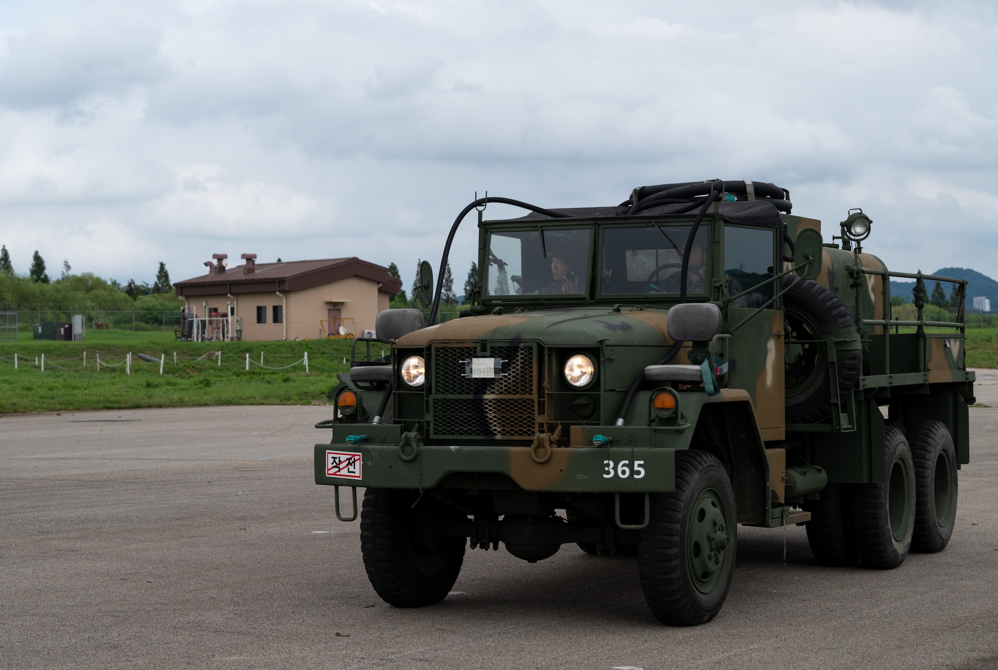 Republic of Korea Armed Forces drive a KM9 decontamination vehicle during combined forces chemical, biological, radiological and nuclear training with the 51st Civil Engineer Squadron at Osan Air Base, ROK, Aug. 24, 2023. The KM9 has specialized equipment to provide readily-available decontamination when called upon. Combined forces training enhances the readiness and interoperability of U.S. and ROK forces. (U.S. Air Force photo by Airman 1st Class Chase Verzaal)