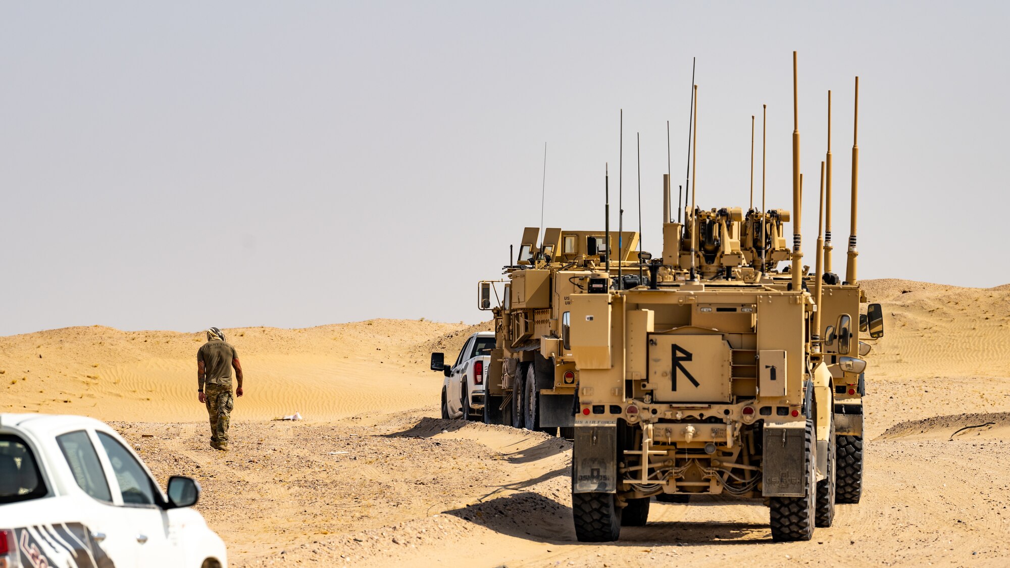 A U.S. Air Force explosive ordnance disposal technician prepares for a large-scale detonation during Operation Solar Flare at Udairi Range, Kuwait, Aug. 24, 2023. Solar Flare is a 5-day, joint-service field training exercise developed and hosted by the 386th and 332nd Expeditionary Civil Engineer Squadron’s EOD teams that brought together 30 Army, Navy, and Air Force personnel for a series of intense training scenarios focused on working together through current and emerging threats in the CENTCOM AOR. (U.S. Air Force photo by Staff Sgt. Kevin Long)