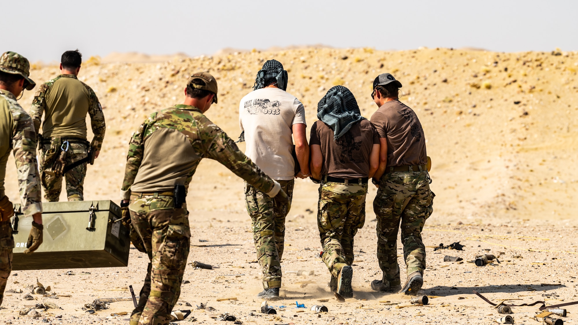 U.S. Army, U.S. Air Force, and U.S. Navy explosive ordnance disposal technicians from across Kuwait unload explosives and expired munitions in preparation for a large-scale detonation during Operation Solar Flare at Udairi Range, Kuwait, Aug. 24, 2023. Solar Flare is a 5-day, joint-service field training exercise developed and hosted by the 386th and 332nd Expeditionary Civil Engineer Squadron’s EOD teams that brought together 30 Army, Navy, and Air Force personnel for a series of intense training scenarios focused on working together through current and emerging threats in the CENTCOM AOR. (U.S. Air Force photo by Staff Sgt. Kevin Long)